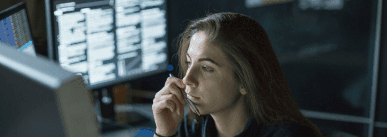 ey-woman-seated-at-desk-surrounded-by-monitors-displaying-data1.jpg.rendition.1800 (1).png